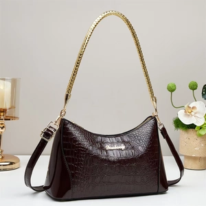 Elegant wine red crocodile pattern shoulder bag with a gold chain handle and glossy finish