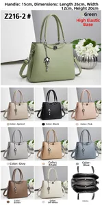 Detail view of large women's tote bag with metal chain, floral pendant and dimensions