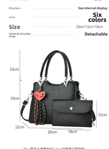 Close-up of black lychee grain tote and clutch set with size and structure details