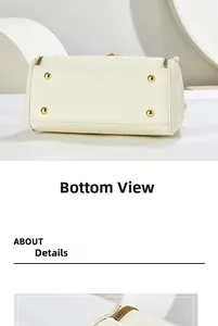 Detail view of cream white handbag base featuring four gold protective metal feet and leather