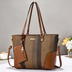 Contrast color tote bag in brown woven texture and leather with small matching pouch