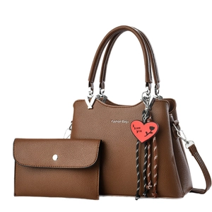 Dark brown faux leather tote set with matching wallet and heart pendant on white background