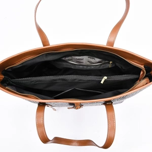 Interior detail of large crocodile pattern tote bag with zip compartments and gold hardware