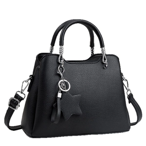 Structured black leather handbag with star pendant and silver-tone metal details