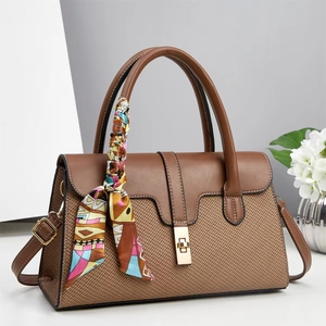 Brown woven leather handbag with metallic turn-lock and decorative silk scarf detail