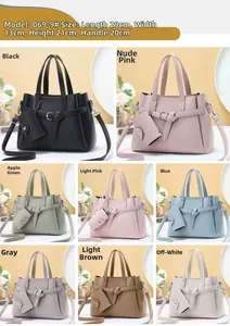 Detailed view of lychee pattern leather handbag in 8 colors with 29x13x21cm dimensions