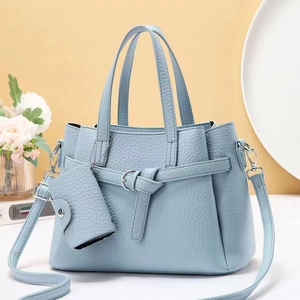 Light blue lychee pattern leather handbag with matching coin purse and silver shoulder strap