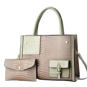 Green crocodile pattern tote bag set with matching pouch and golden hardware details