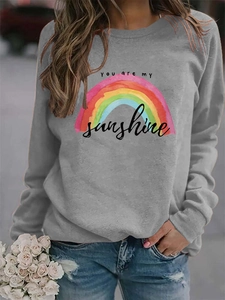 Close-up of You are my sunshine rainbow print on a grey long sleeve pullover sweatshirt