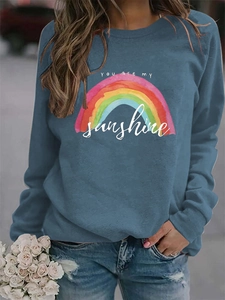 Detail of colorful rainbow print and You are my sunshine text on dark grey sweatshirt
