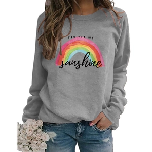 Detail of gray crewneck sweatshirt with rainbow print and You Are My Sunshine text