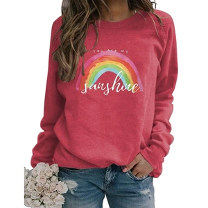 Close-up of the rainbow print and YOU ARE MY sunshine text on the red sweatshirt