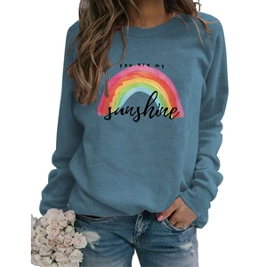 Detail of blue rainbow sweatshirt with You Are My Sunshine print and crewneck design