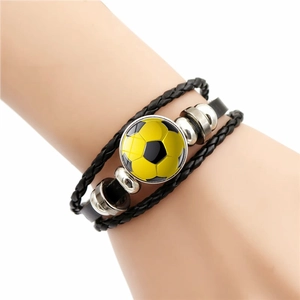Multilayer braided leather soccer bracelet featuring a yellow football gemstone on wrist