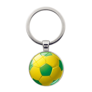 Silver metal football keychain with green and yellow soccer ball glass dome pendant