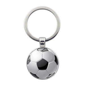 Detailed view of silver metal keychain with glass dome and soccer ball graphic motif