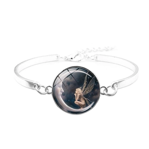 Close-up of silver chain bracelet featuring a glass moon fairy illustration charm