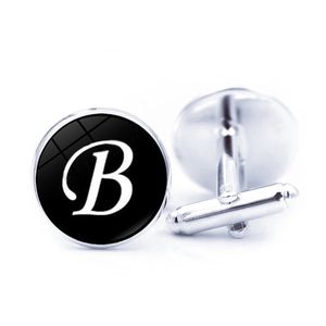 Pair of silver French shirt cufflinks with black glass cabochon featuring white letter B