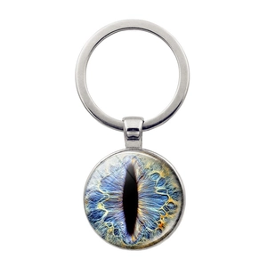 Blue dragon eye glass gem keychain with silver metal ring on a white background