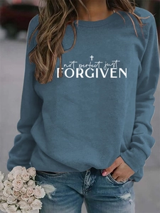 Detailed shot of the blue crewneck sweatshirt with Not Perfect Just Forgiven graphic print
