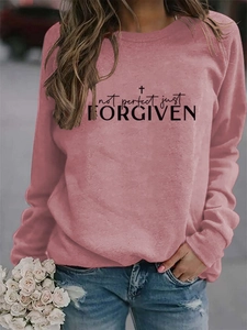 Detail of Not Perfect Just Forgiven print on a soft pink crew neck sweatshirt