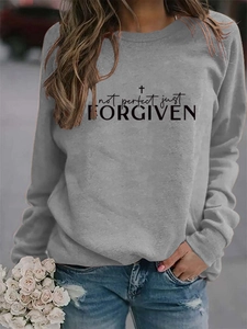 Detail of Not Perfect Just Forgiven print on grey crewneck sweatshirt with cross icon