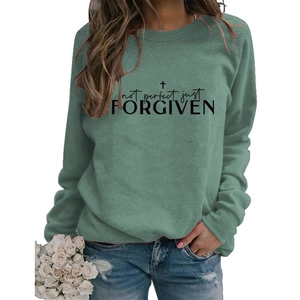 Detail of sage green sweatshirt with Not Perfect Just Forgiven graphic and cross design