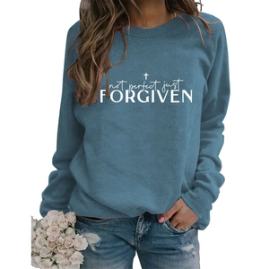 Detail of Not Perfect Just Forgiven graphic print on a blue long sleeve crewneck sweatshirt