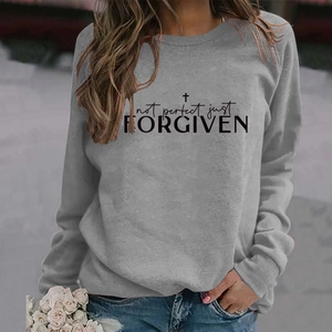 Detail of grey crewneck sweatshirt with Not Perfect Just Forgiven text and cross print