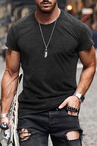 Detail view of charcoal grey slim fit men's T-shirt on a model holding a skateboard