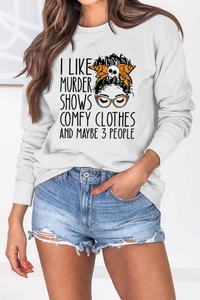 Detail of white crewneck sweatshirt featuring a quirky graphic print and leopard hairband