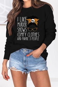 Close-up of printed graphic on black long sleeve sweatshirt with skeleton illustration