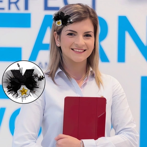 Detail of graduation party hair clip with black lace bow and shiny star sequins