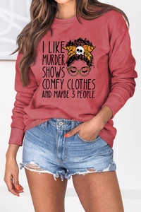 Close-up of a red round neck sweatshirt featuring a graphic print and ribbed cuffs