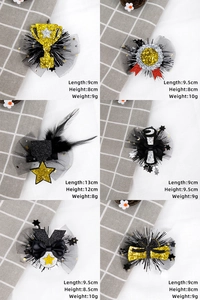 Detail showing various graduation hair clips with glitter trophy and medal shapes