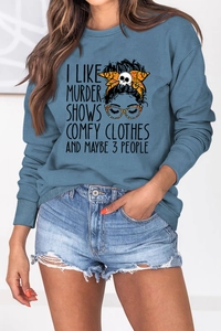 Detail view of fog blue sweatshirt featuring artistic illustration and typography text