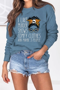 Detail view of I LIKE MURDER SHOWS quote and lady portrait print on gray-blue sweatshirt