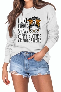 Detail of white crewneck sweatshirt with 'I LIKE MURDER SHOWS' text and figure illustration
