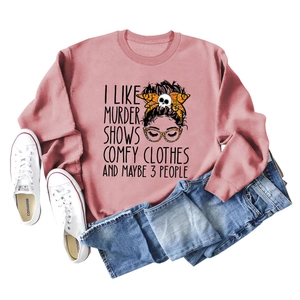 Flat lay of pink round neck sweatshirt with graphic print, jeans and white sneakers
