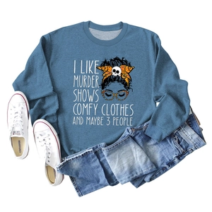 Flat lay of Harbor Blue sweatshirt with 'I LIKE MURDER SHOWS' print and denim jeans