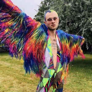 Detailed view of colorful rain silk tassel fringe on a rainbow festival party jacket