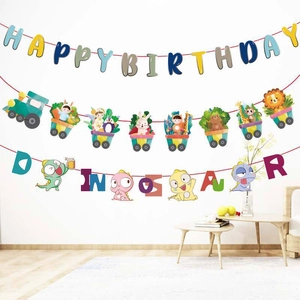 Close-up of Happy Birthday animal train and dinosaur themed paper banners for party decor