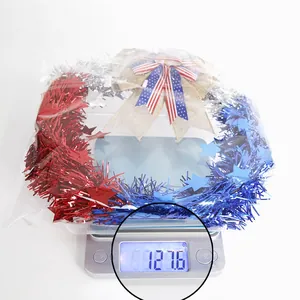Detail showing an Independence Day wreath with burlap bow on a digital scale