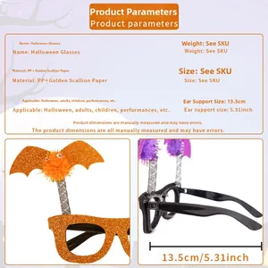 Detail of Halloween bat glasses with orange glitter coating and plush pom-poms