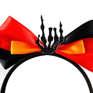 Halloween headband with layered orange red bows and glittery skull hand centerpiece