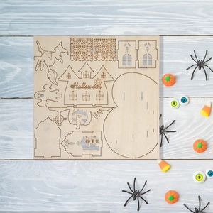DIY Halloween wooden puzzle kit with castle pumpkin and ghost on blue background