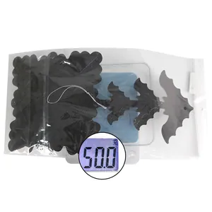 Detailed view of Halloween honeycomb decorations in polybag weighing 50.0g on scale