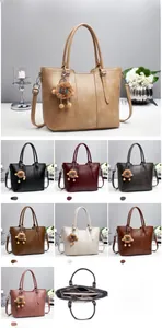 Detailed view of the large capacity tote bag interior with multiple compartments and zippers