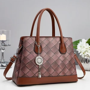 Retro hand-woven color-block tote bag with metallic texture and elegant tassel charms