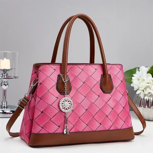 Contrast color woven leather handbag with brown handles and elegant pendant for women